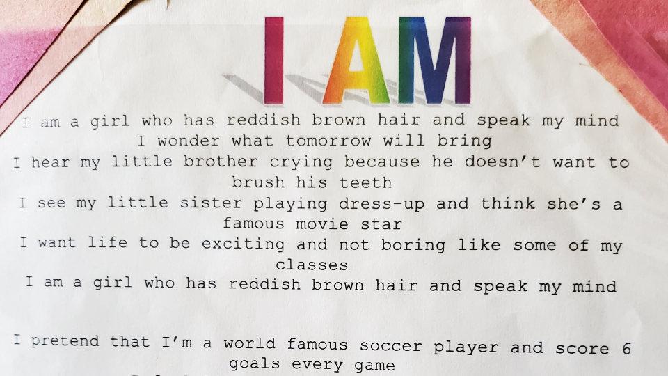 The original "I Am" poem with classic Microsoft rainbow Word Art and pink construction papers on the corners